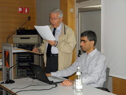 Alessandro Sanvito at a lecture in Bolzano, May 2011, assisted by Luca D'Ambrosio.