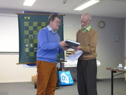 The then chairman Guy van Habberney is handing over to Peter Monté a gift –of course a book– as sign of appreciation for his very interesting lecture during the meeting of the CH&LS in Wijk aan Zee on Januari 24th, 2015