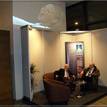 Helmut Metzing talking in a quiet corner