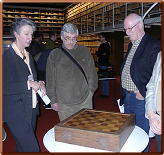 Dr. Bepler, Tony Gillam and Calle Erlandsson next to the game board of Duke August